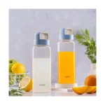 Borosil 750ml Crysto Bottle Set with Lid | Borosilicate Glass Wide Mouth Bottle for Fridge | Extreme Temperature Resistant For Hot & Cold Water, Milk, Lassi, Juice (Pack of 2, Blue Husk Lid)